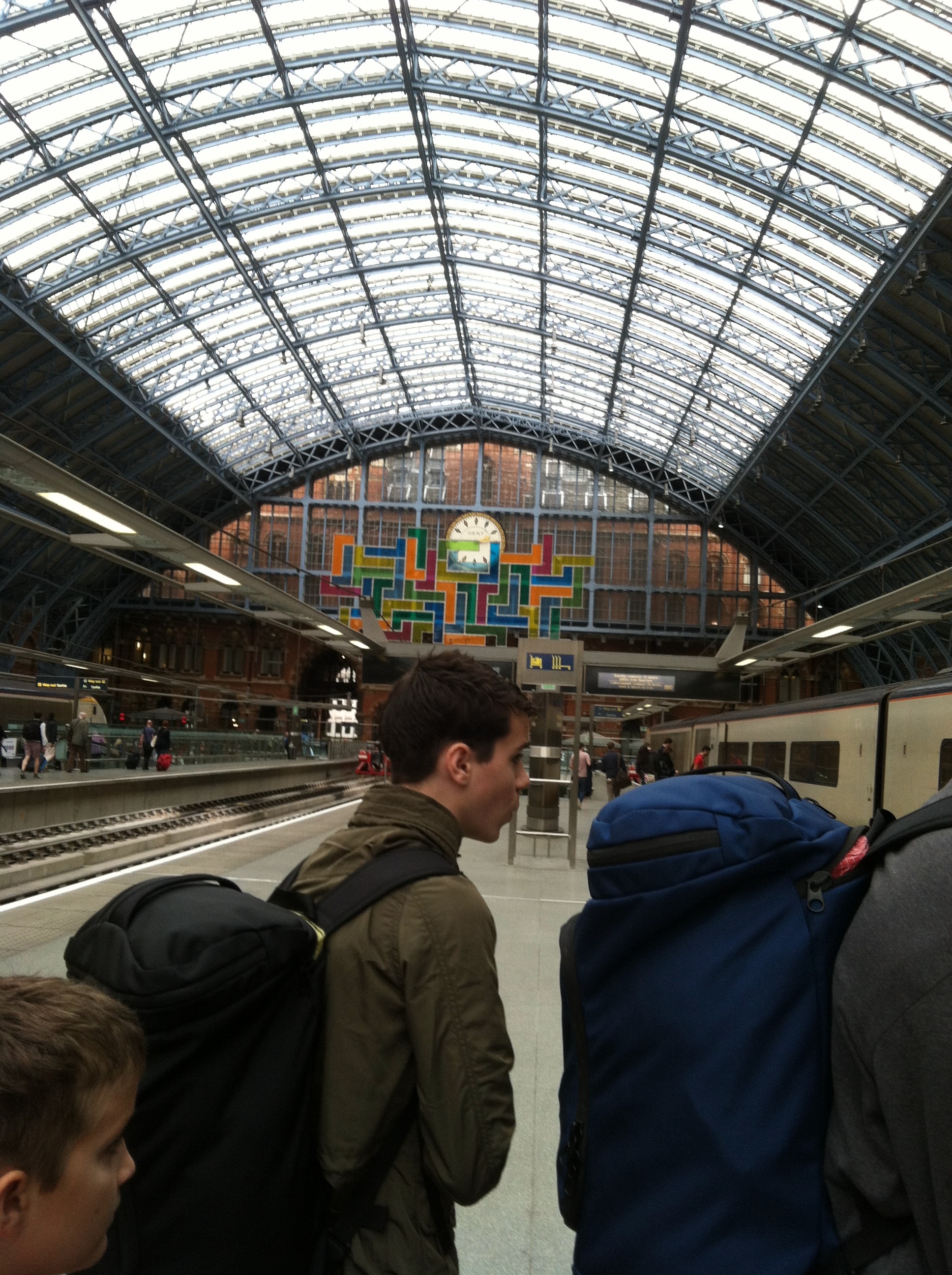boys with backpacks boarding the Eurostar in Pancras station.